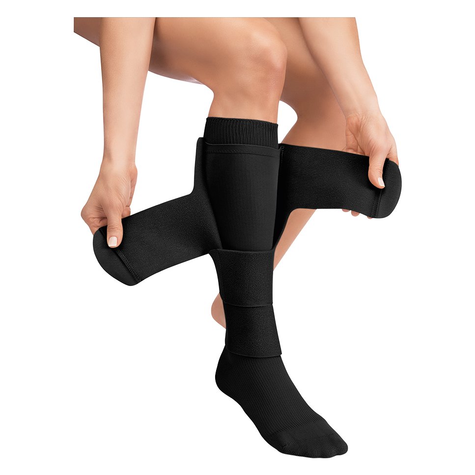 JOBST FarrowWrap 4000 Legpiece in Black being wrapped around the lower leg over a liner